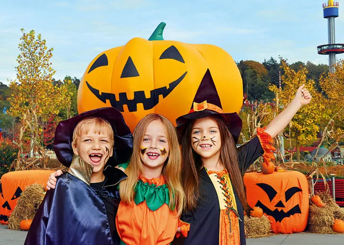 LEGOLAND Halloween children dressed up in front of a big pumpkin