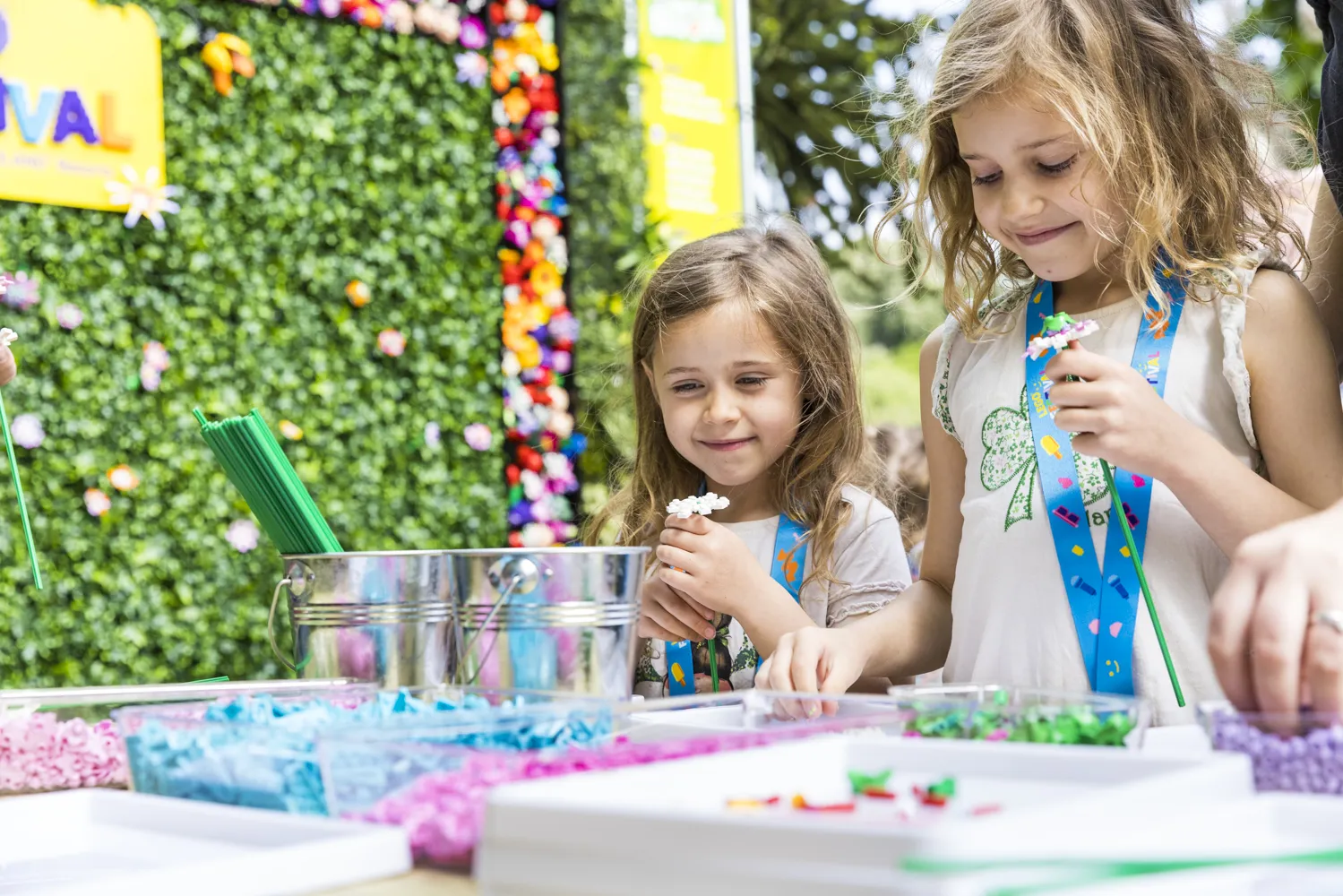 Children build flowers from LEGO in the Chill Out Zone at the LEGO Festival