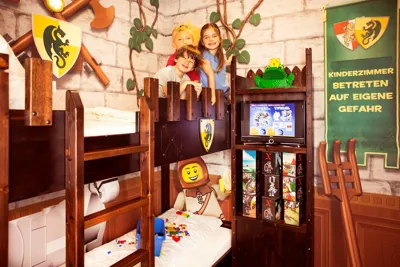 LEGOLAND castle rooms with kids on a bed